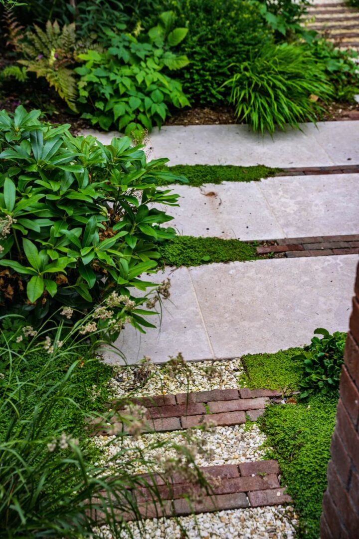 Close-up shot showing the different types of paving used in an Artisan Landscapes garden design